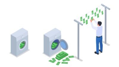 Man hanging money on a clothesline, symbolizing money laundering.